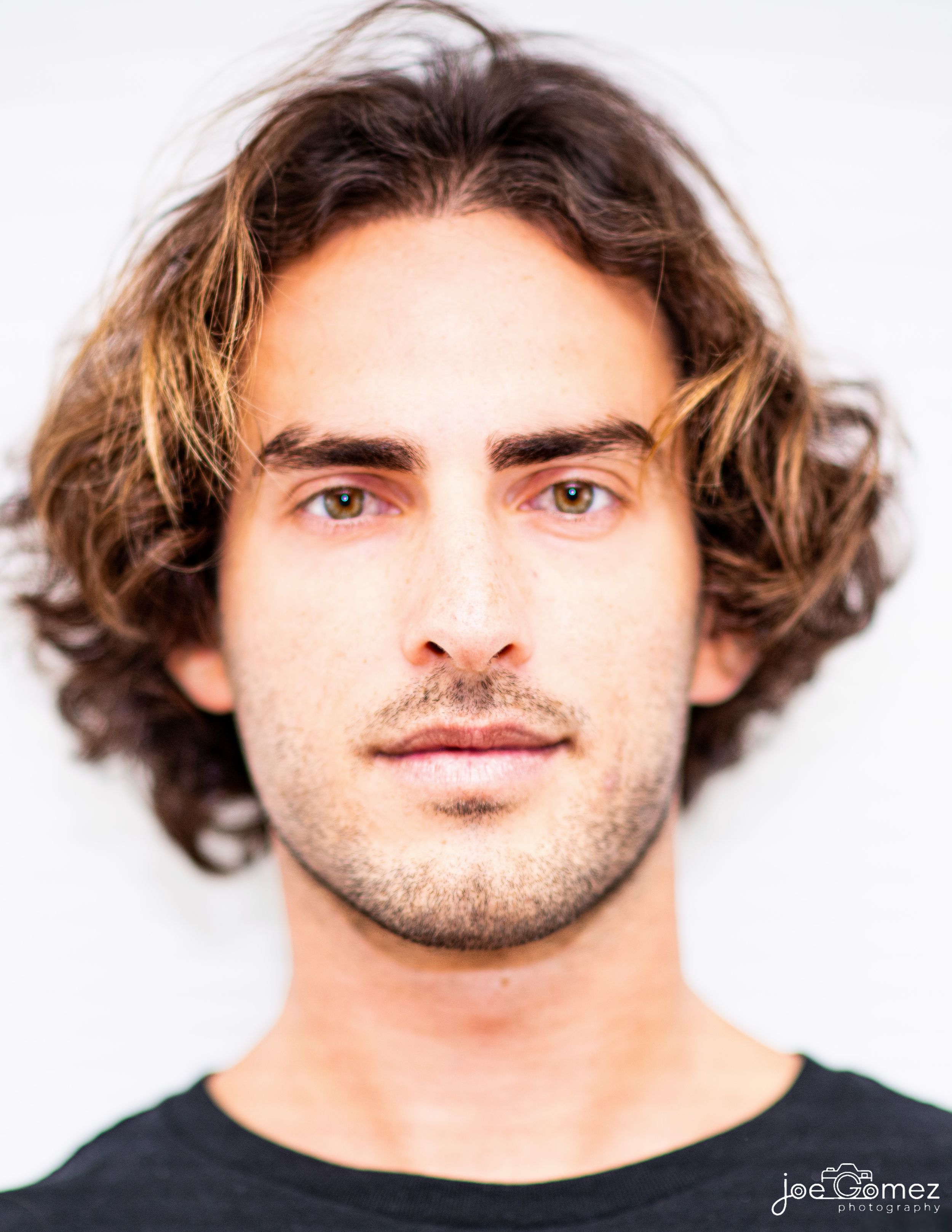 Professional actor headshot of a male performer with natural expression and clean studio lighting, photographed in Los Angeles by Joe Gomez.